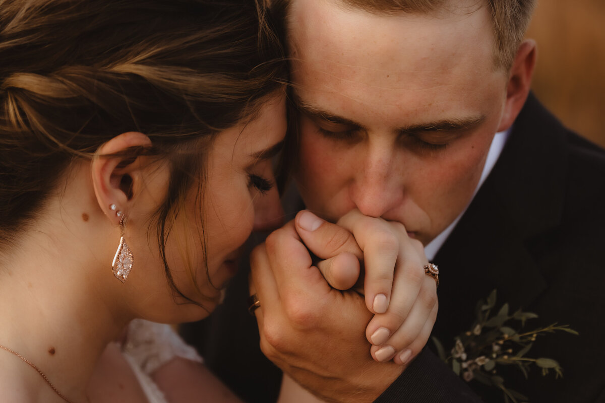 HAND HOLDING AND KISSING CLOSE UP