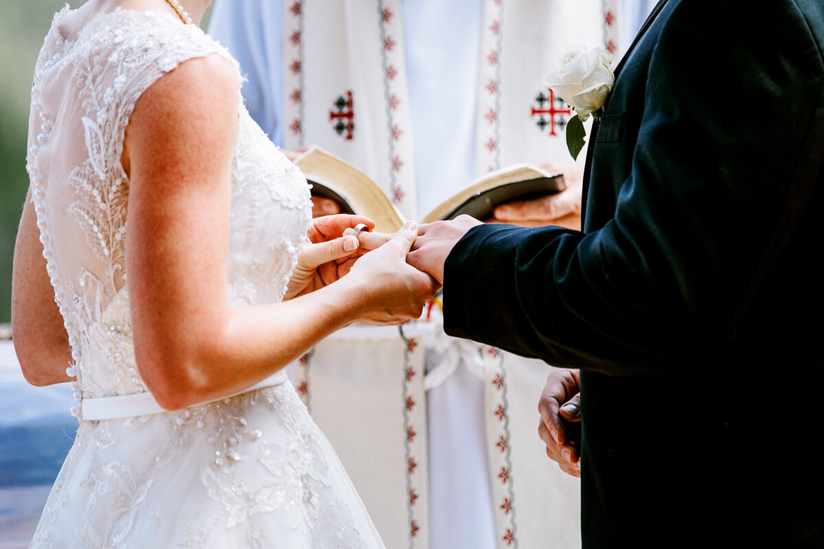 A bride puts a ring on her man at a Lodge at Breckenridge wedding