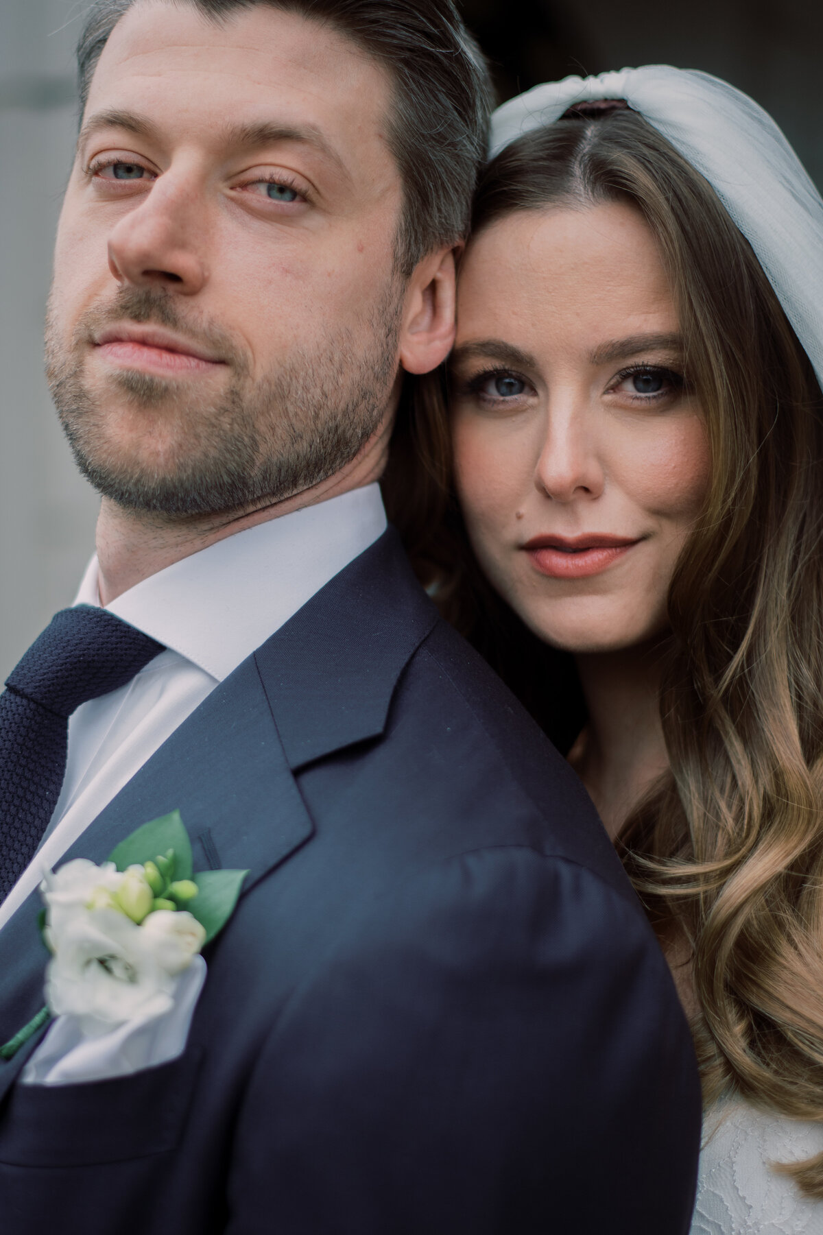 Bride and groom close up looking posh