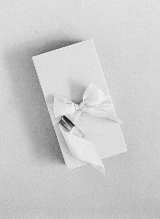 linen presentation box with usb stick on top, box wrapped with silk ribbon