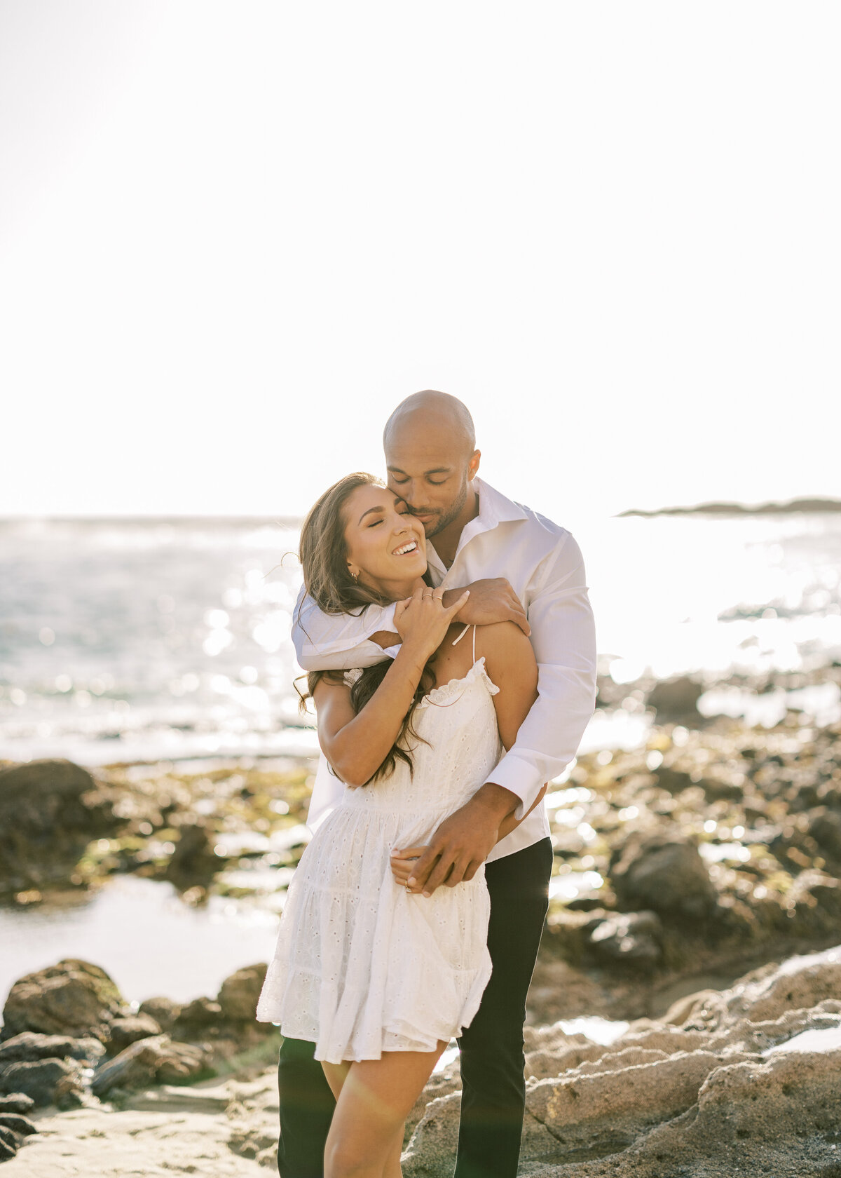 romantic engagement photo on the beach