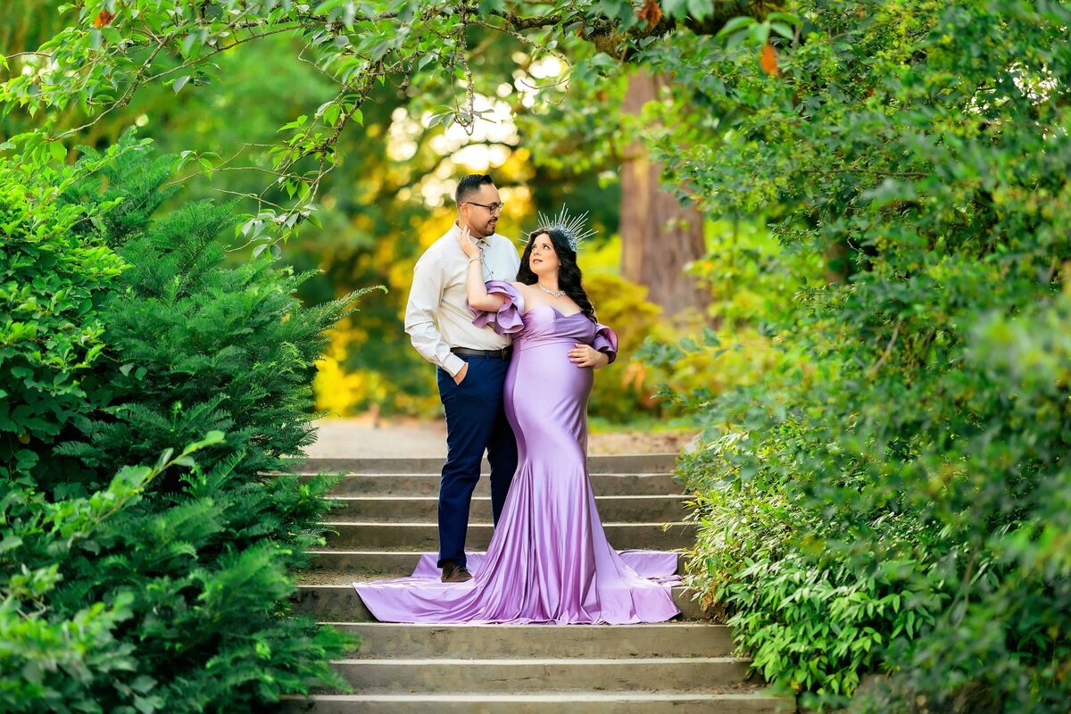 expectant mom and partner on stairs