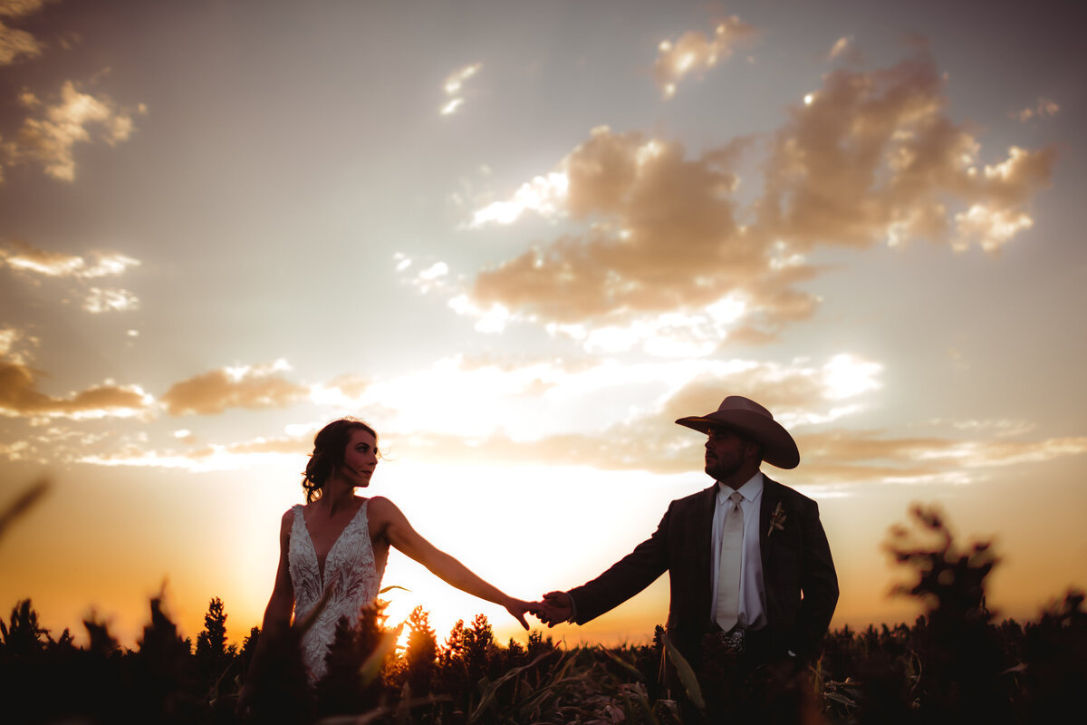 BRIDE GROOM WEDDING SUNSET GOLDEN HOUR SKY