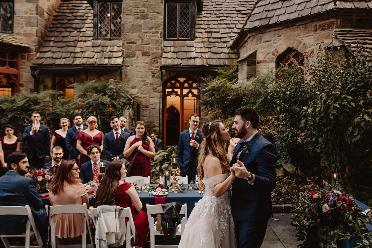 A wedding couple dancing at their reception 