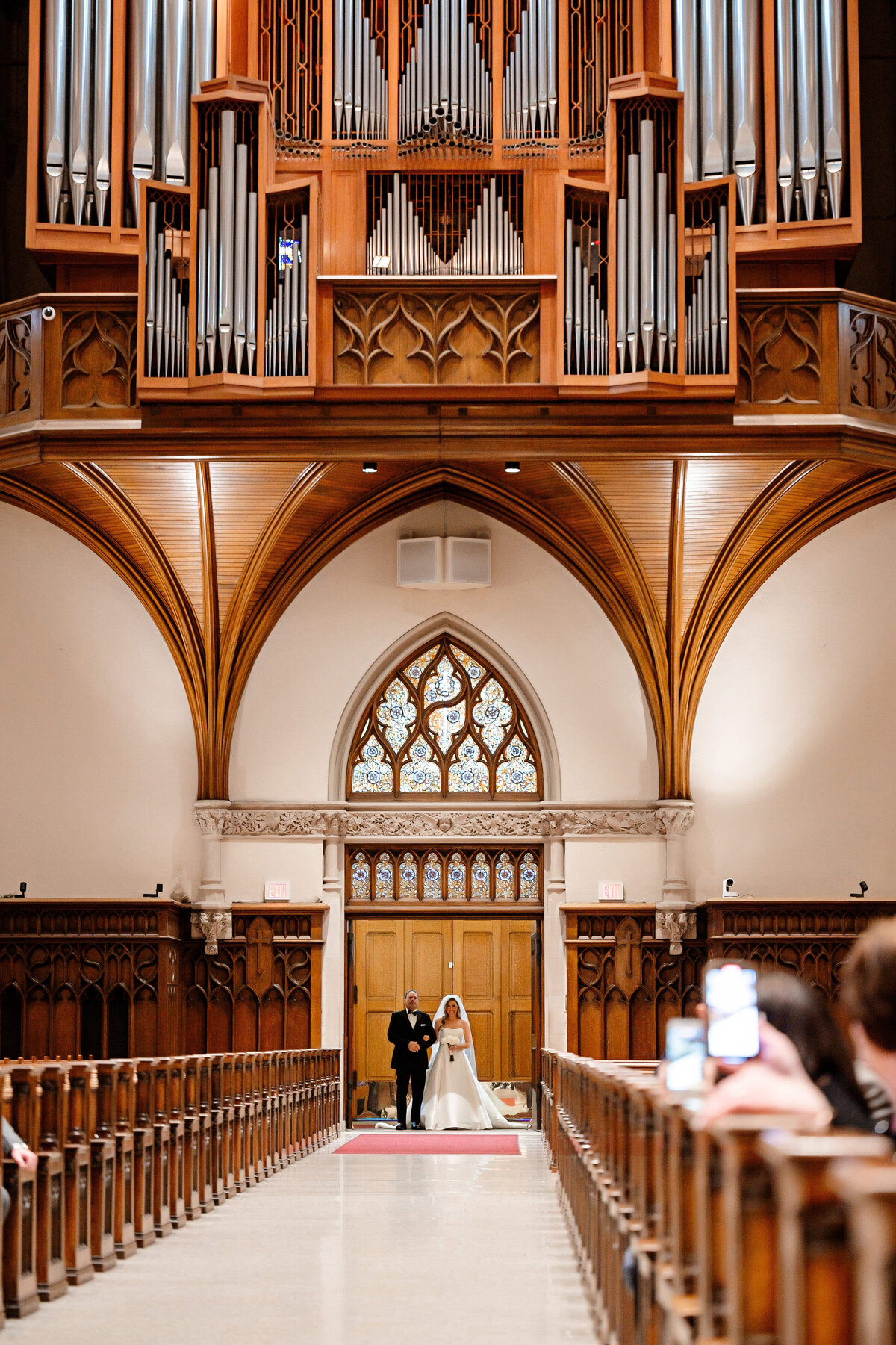 bride at the end of the aisle starting wedding ceremony at st paul cathedral