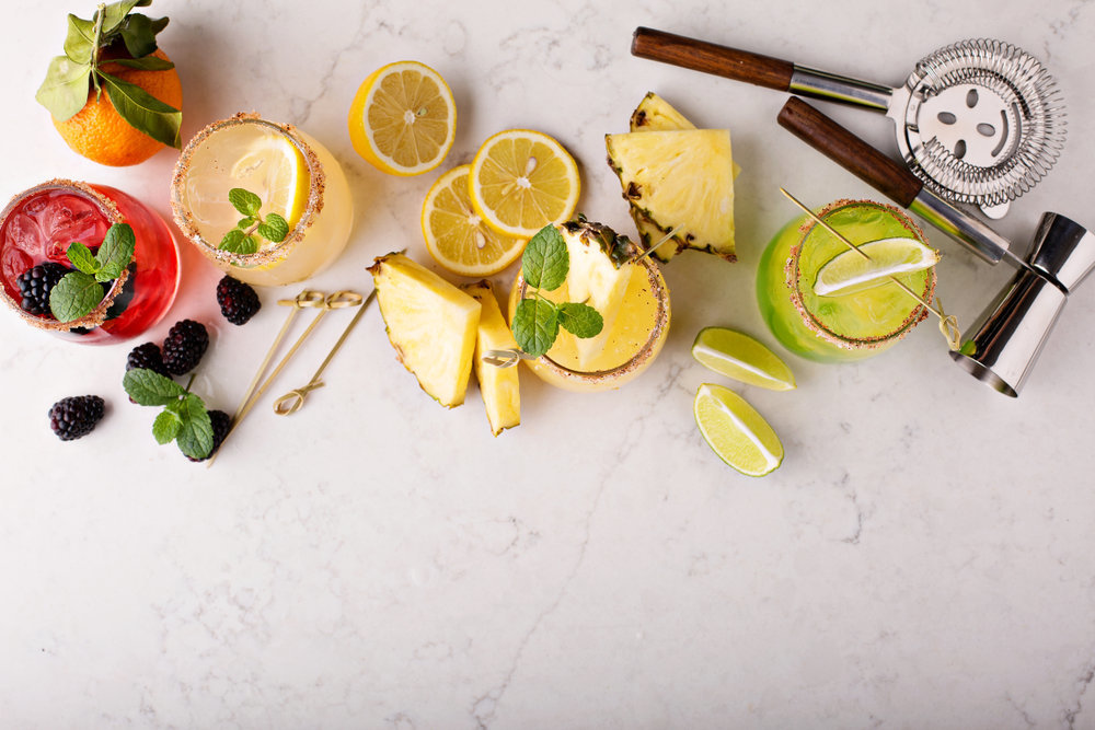Brightly colored specialty cocktails, garnishes, bar supplies