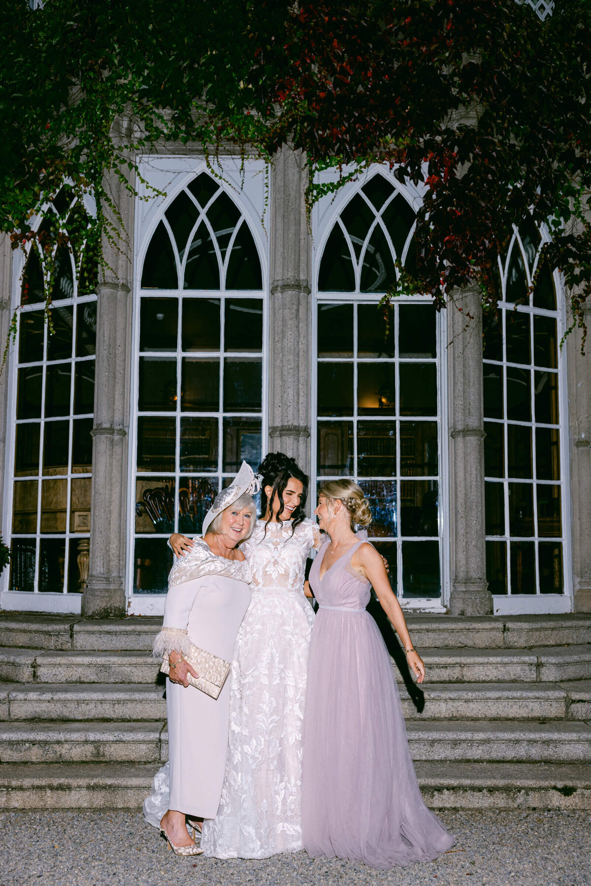A wedding photo of a bride with her mom and sister at Luttrellstown Castle in Dublin Ireland