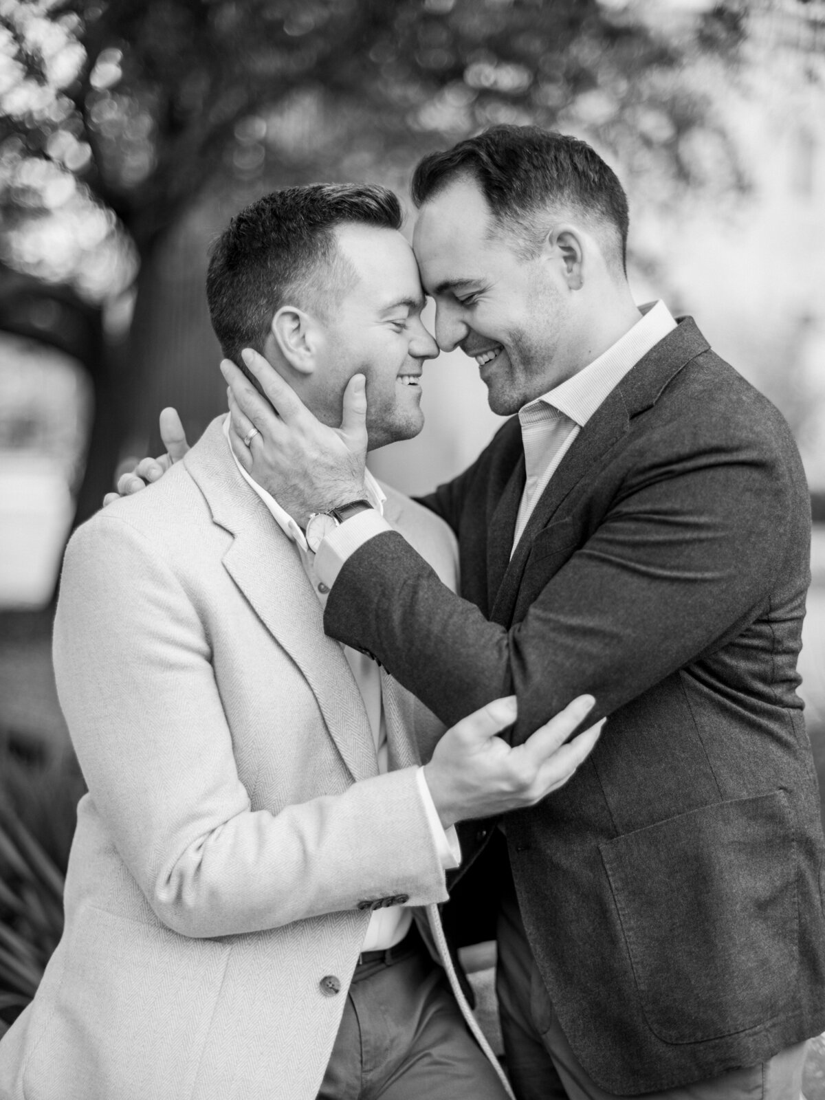 A tender embrace between a couple is captured in a stunning black and white format, emphasizing their emotional connection and the beauty of mutual affection.
