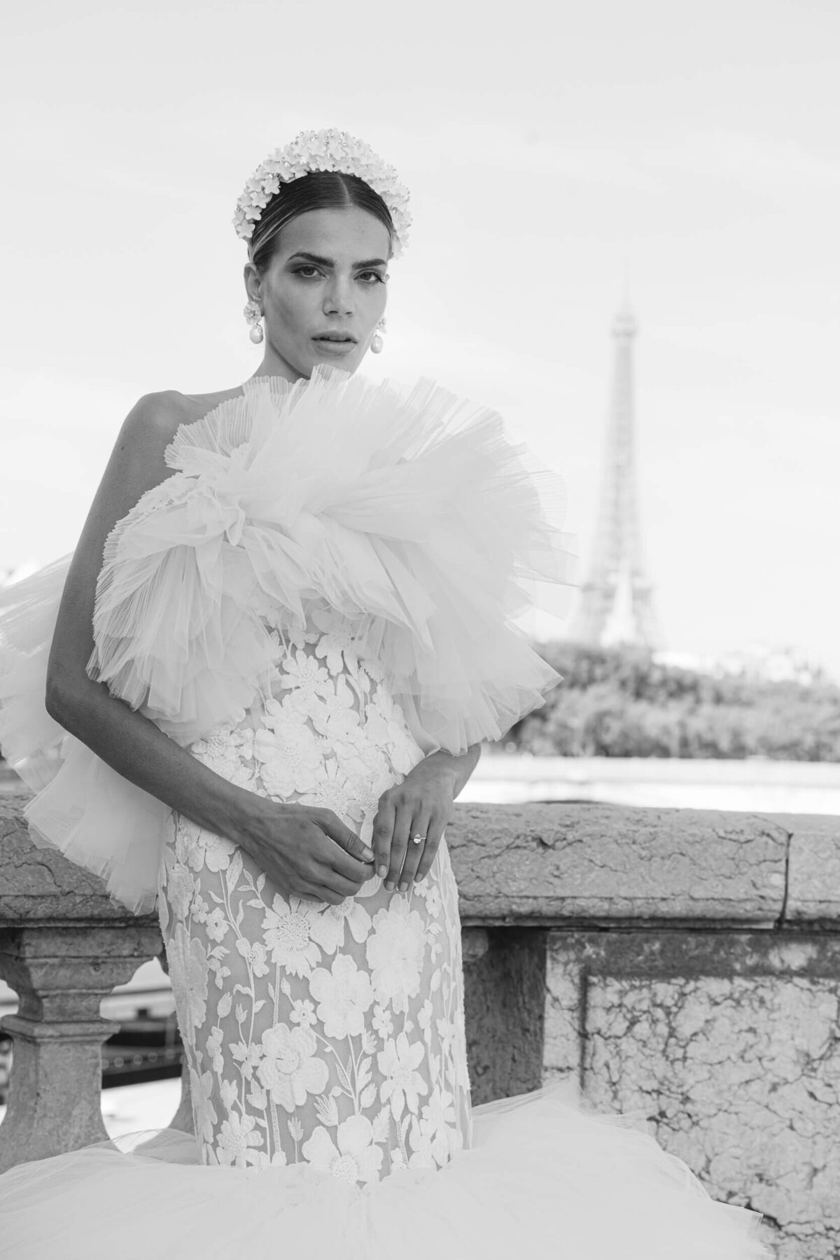 A wedding photo of a bride in her white dress in the streets of Paris in France.