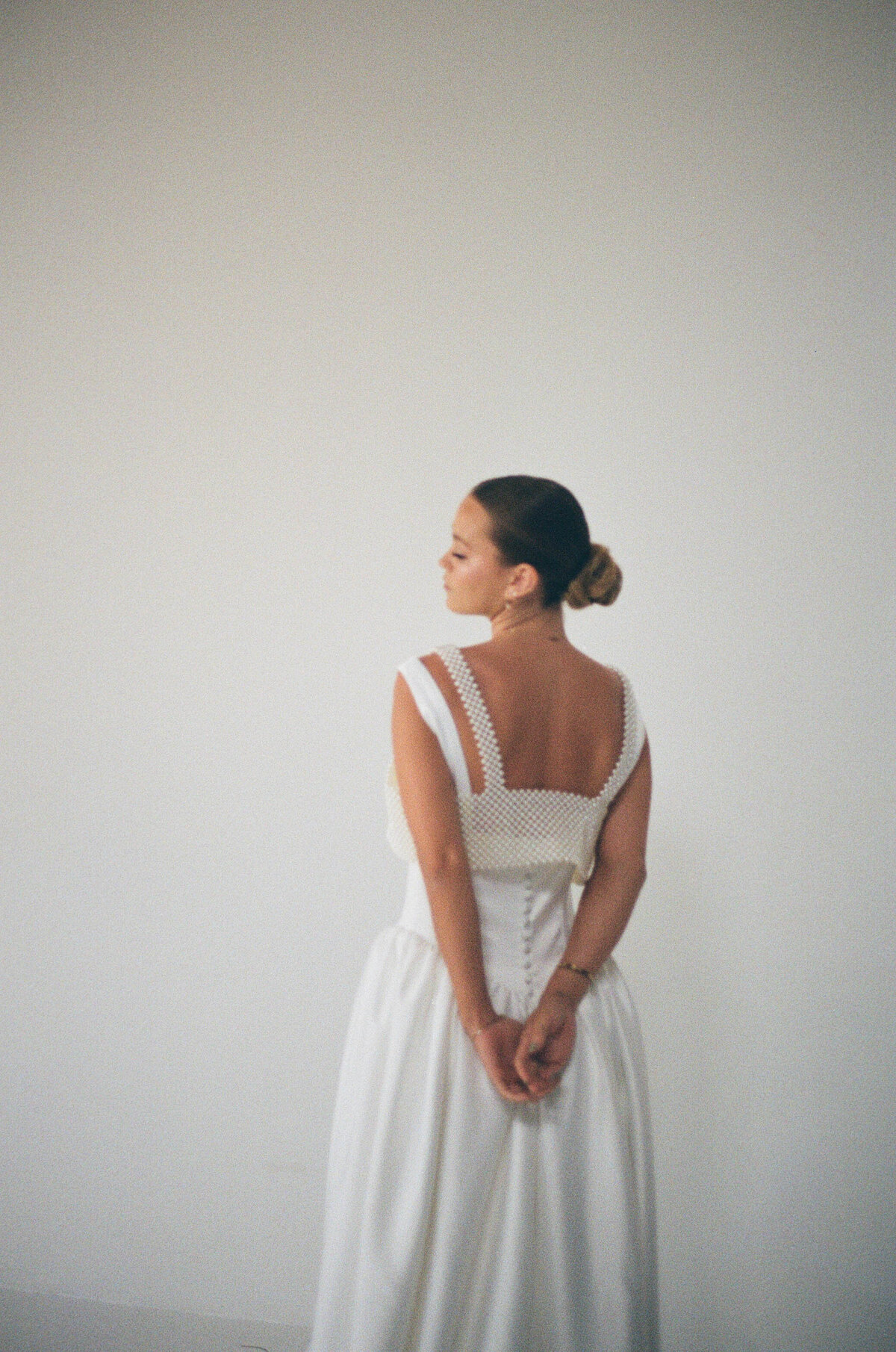 bride against white wall