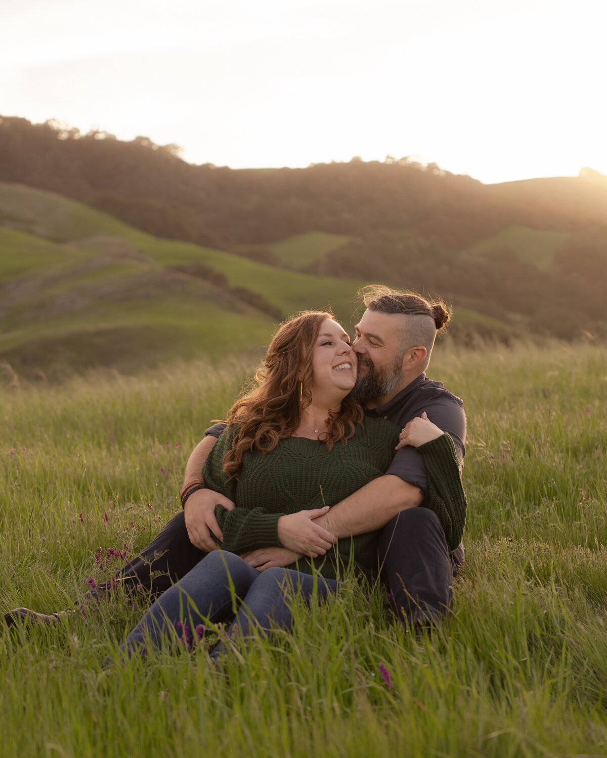 Couples Engagement Photos golden hour sitting in field on the Central Coast in San Luis Obispo 