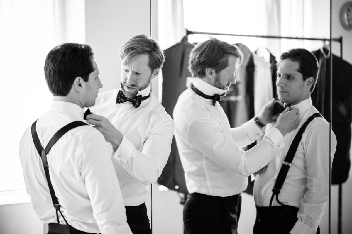 Mark's friend helps him with his bowtie