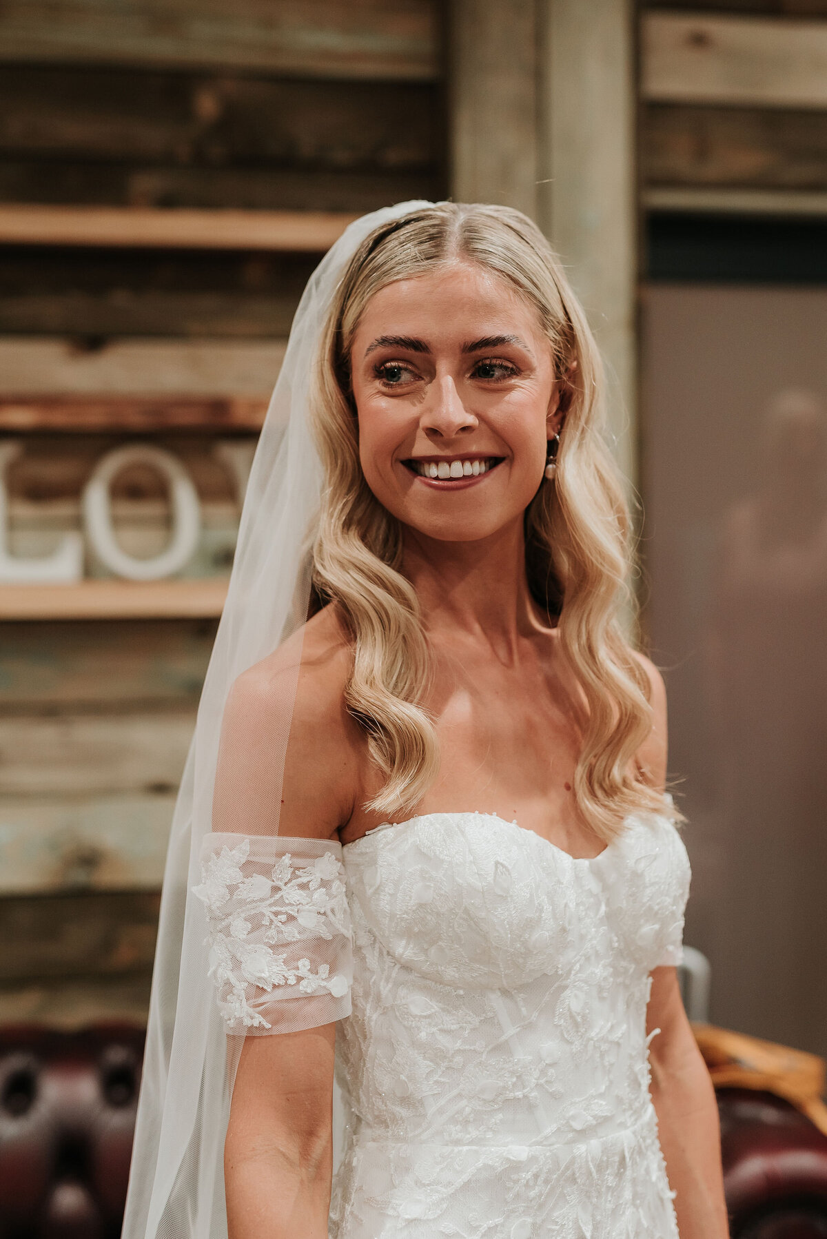 Beautiful bridal portrait of smiling blonde bride at her barn wedding at Southlands Barn, Sussex