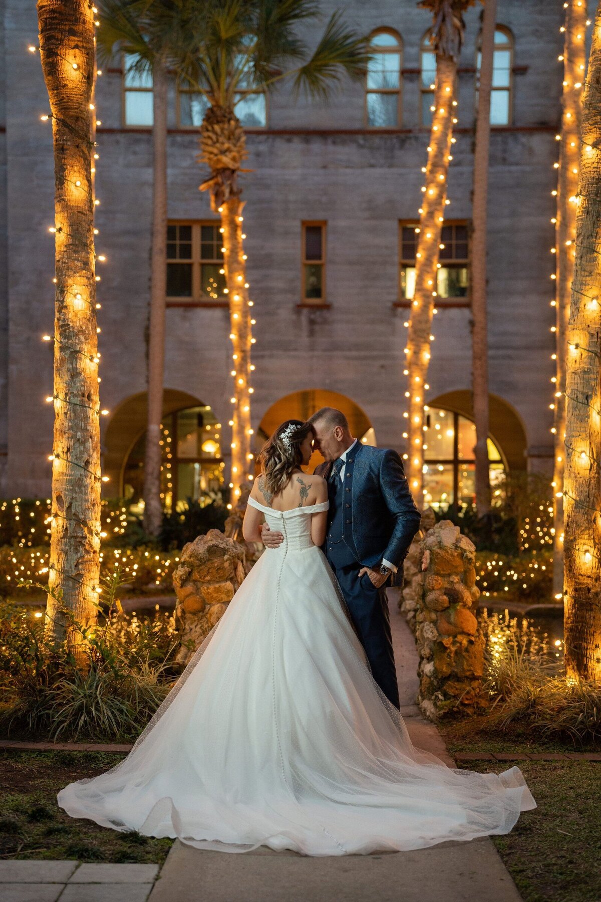 A-romantic-moment-at-the-historic-Lightner-Museum-illuminated-by-enchanting-palm-trees-during-nights-of-lights