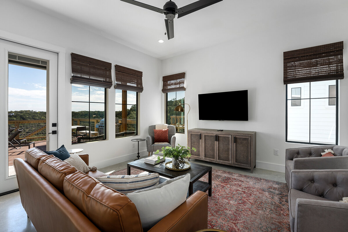 modern living room design with black windows and view to porch