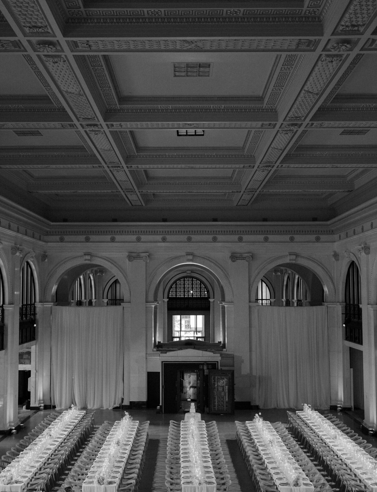 Symmetry & stunning architecture with candlelit dinner tables at State savings bank in Detroit, Michigan