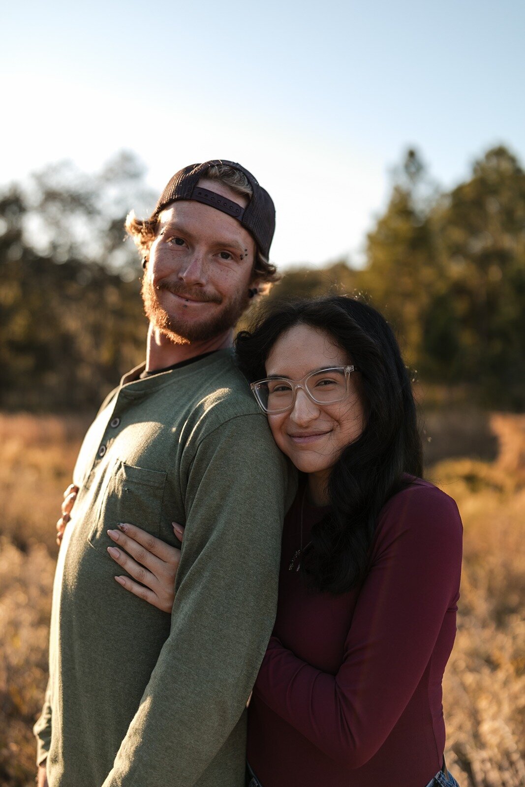 boyfriend and girlfriend look at camera and smile