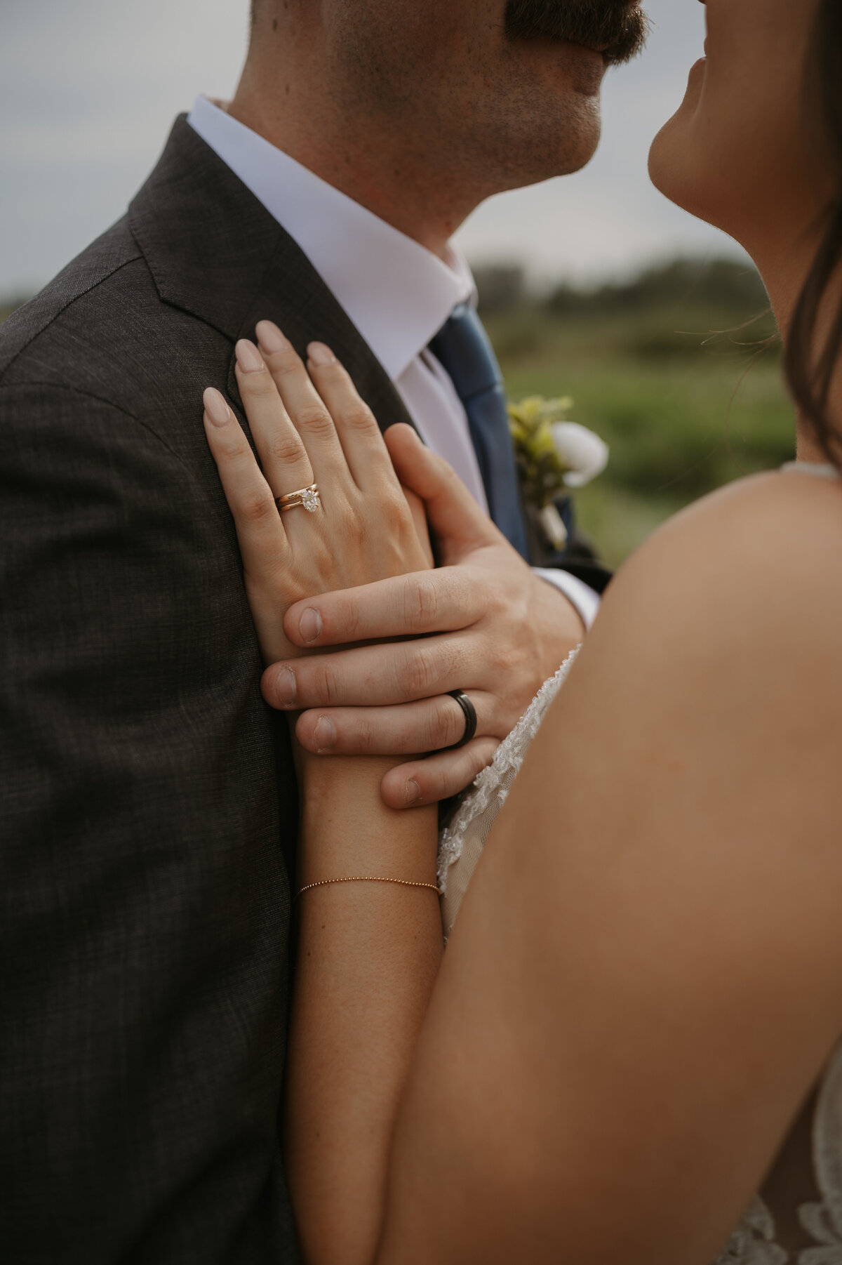 close up of wedding ring during couples photos