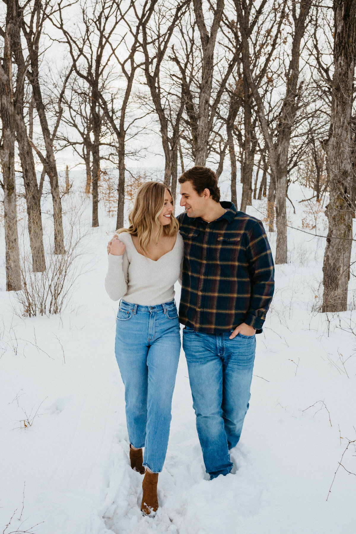 couple-walking-through-snow