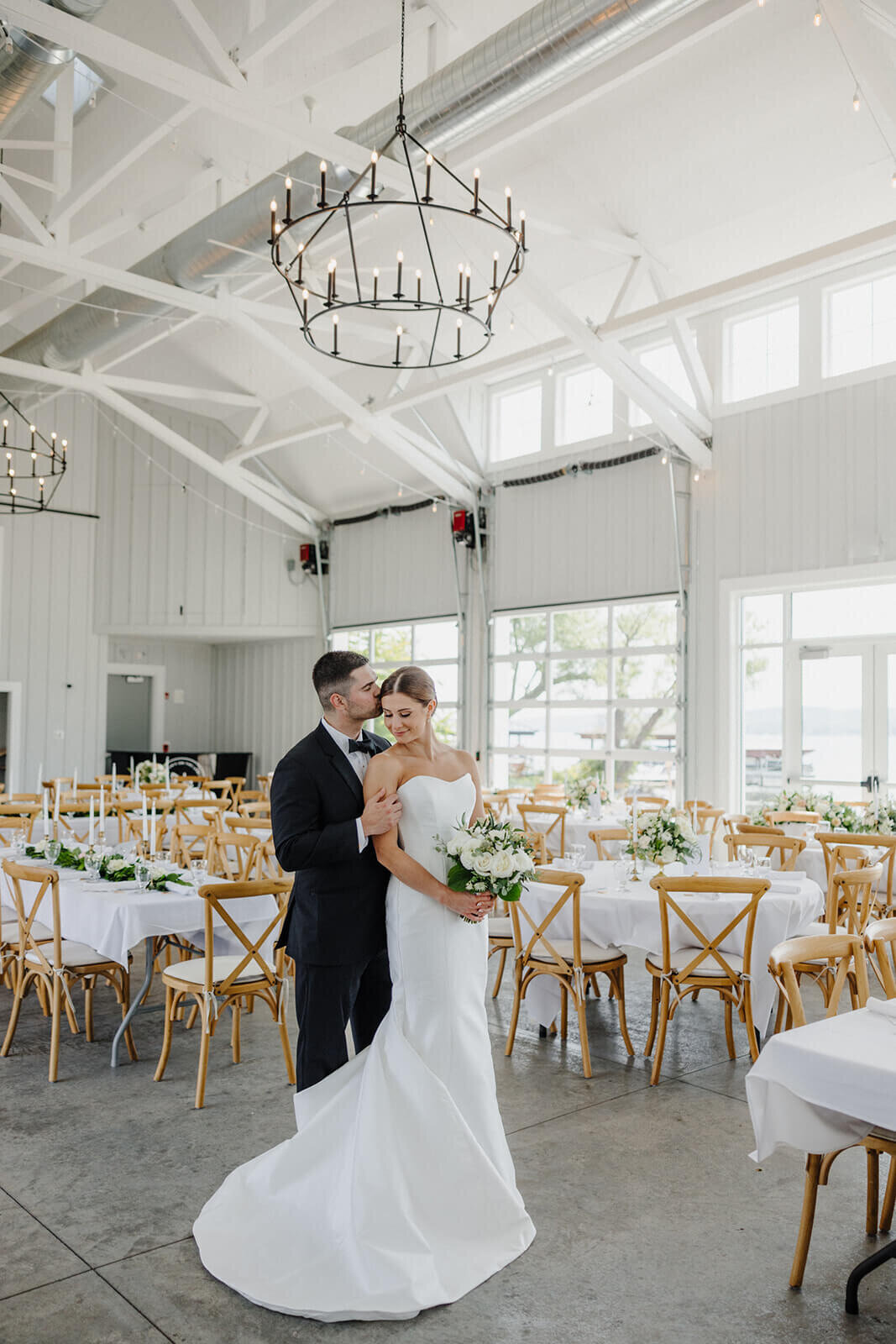 Bride and groom standing in reception space at Canandaigua Country Club wedding, NY