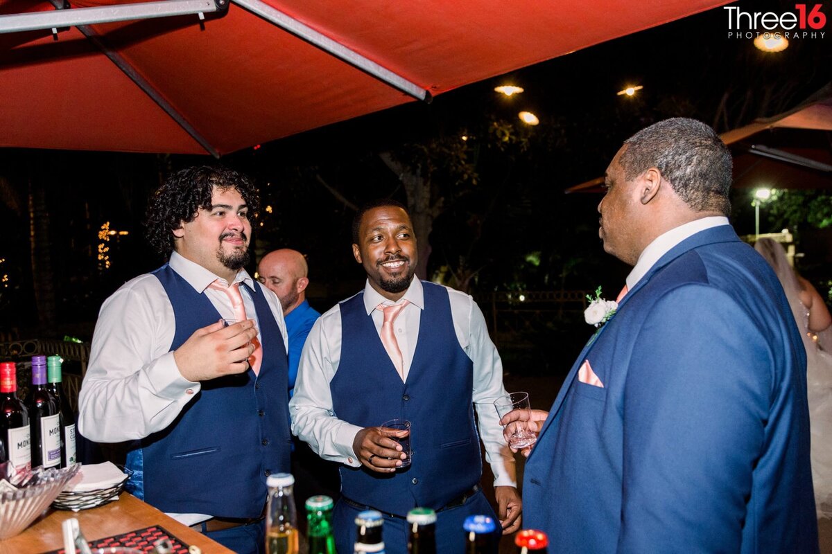Groom and his Groomsmen share a laugh during the reception