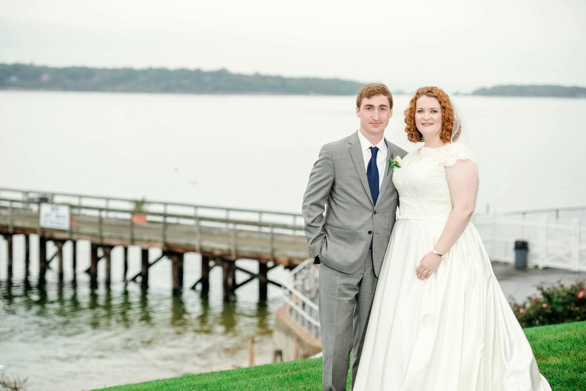 Bride and groom by the dock at Head of the Bay Club