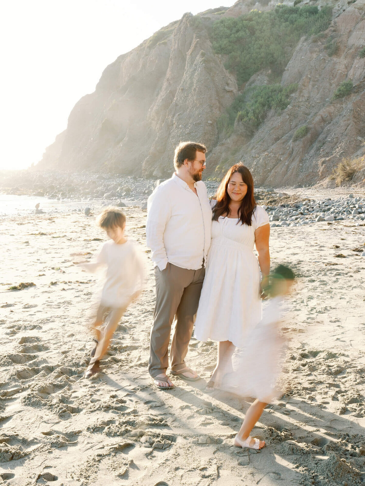 laguna beach family photo mini session kids running around parents