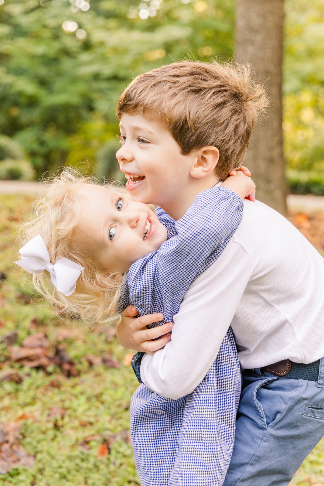 toddlers hugging and laughing in a park in Atlanta GA
