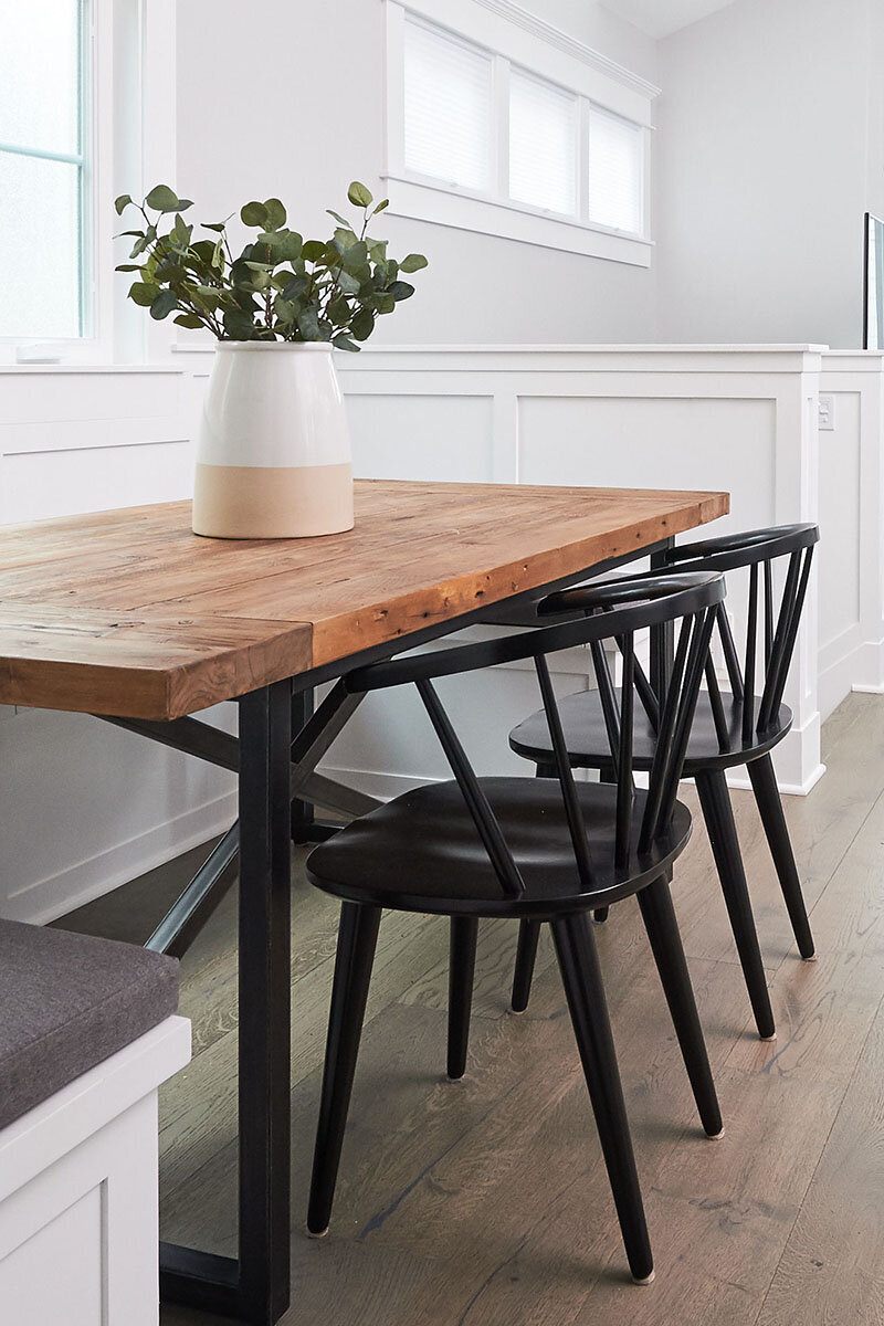 Wood table with black chairs