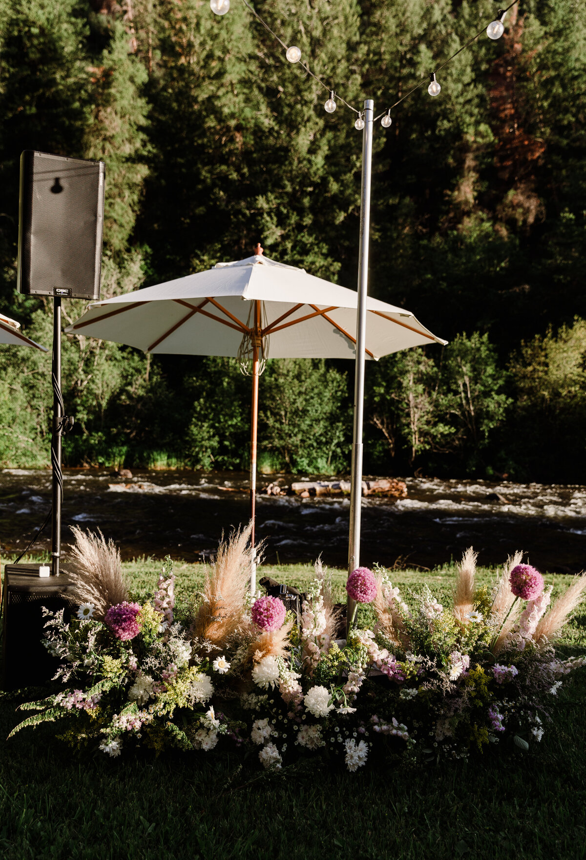 Sunshade and floral arrangements at Dallenbach Ranch Wedding reception Colorado