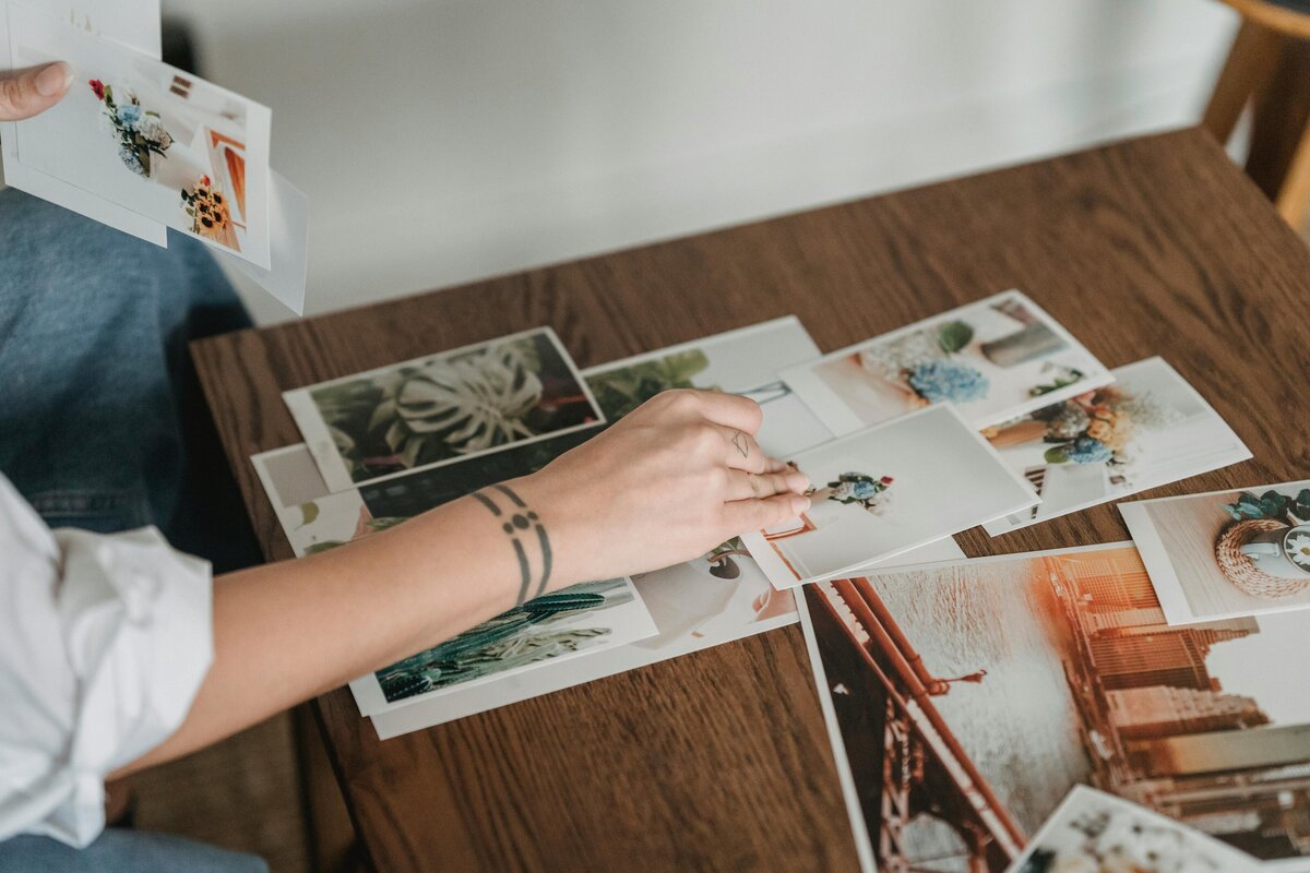woman's hand touching different images 