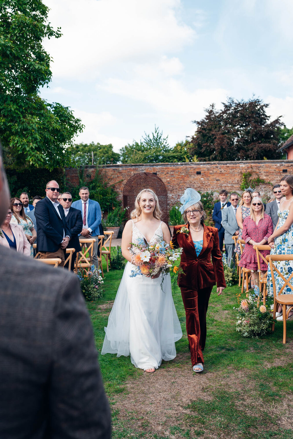 Pauntley-court-wedding-photographer- bride-walking-down-the-aisle