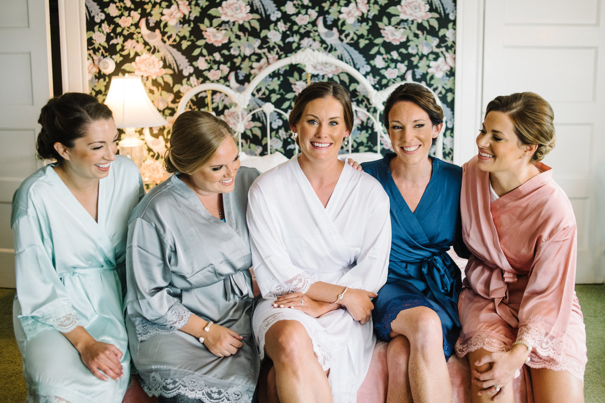 Bride and bridesmaids getting ready in robes