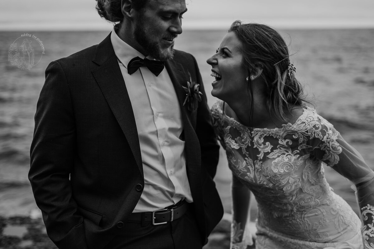 married couple laughing black and white photo
