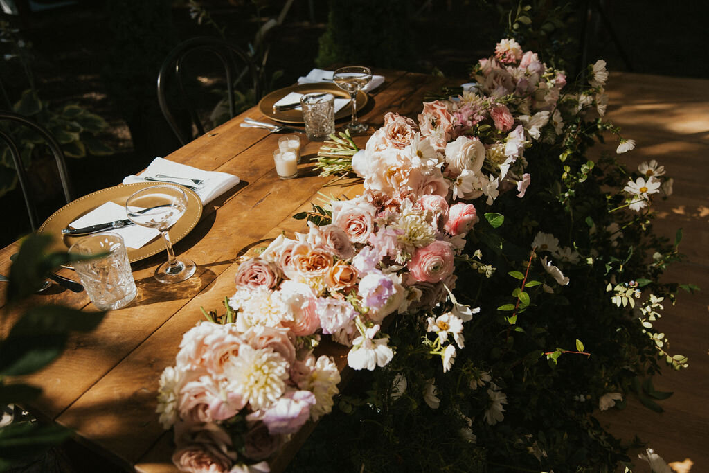Intimate outdoor elopement table setup surrounded by nature, captured by NYC wedding and elopement photographer Dom Augustine.