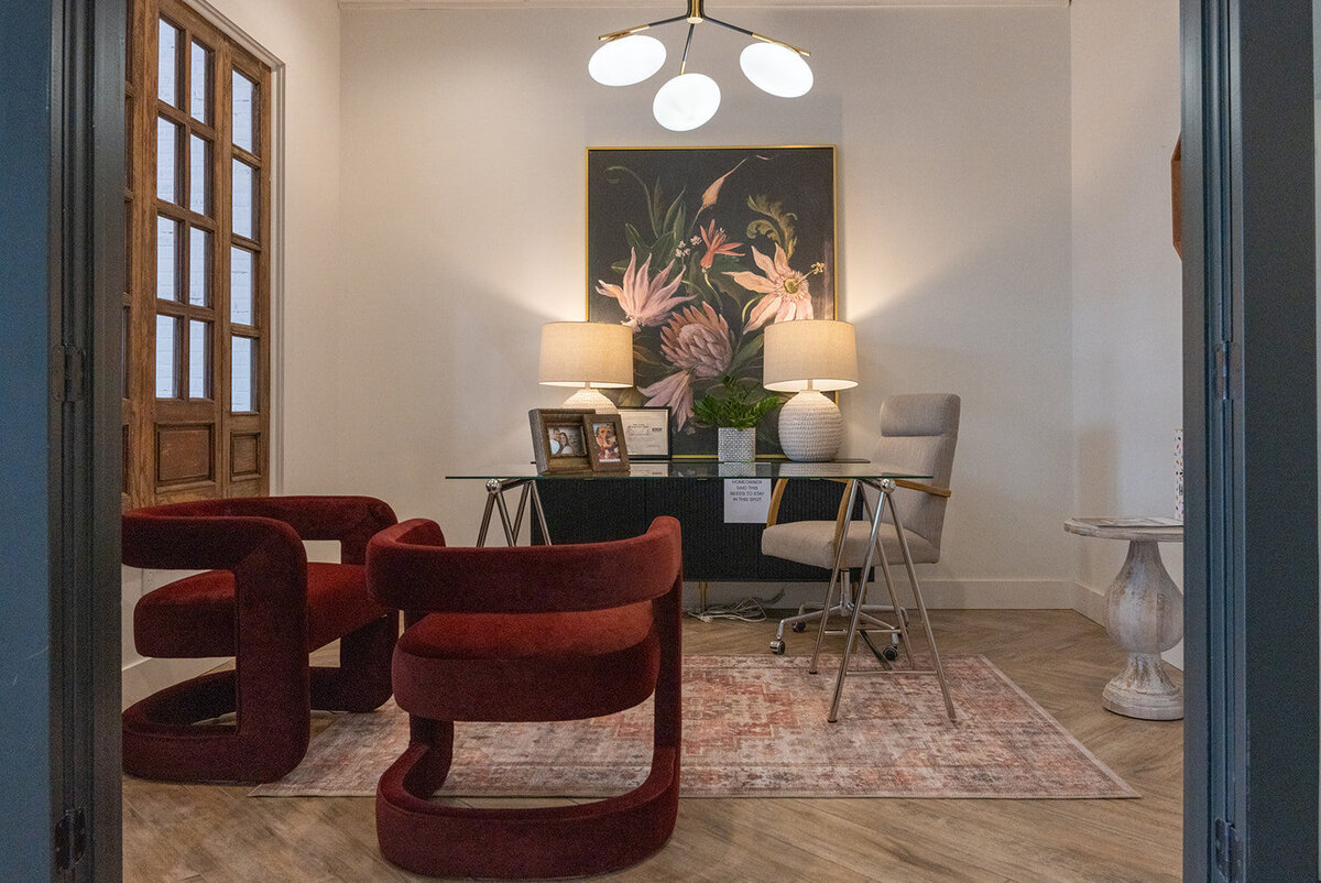 office with desk, lamps, 2 red round chairs
