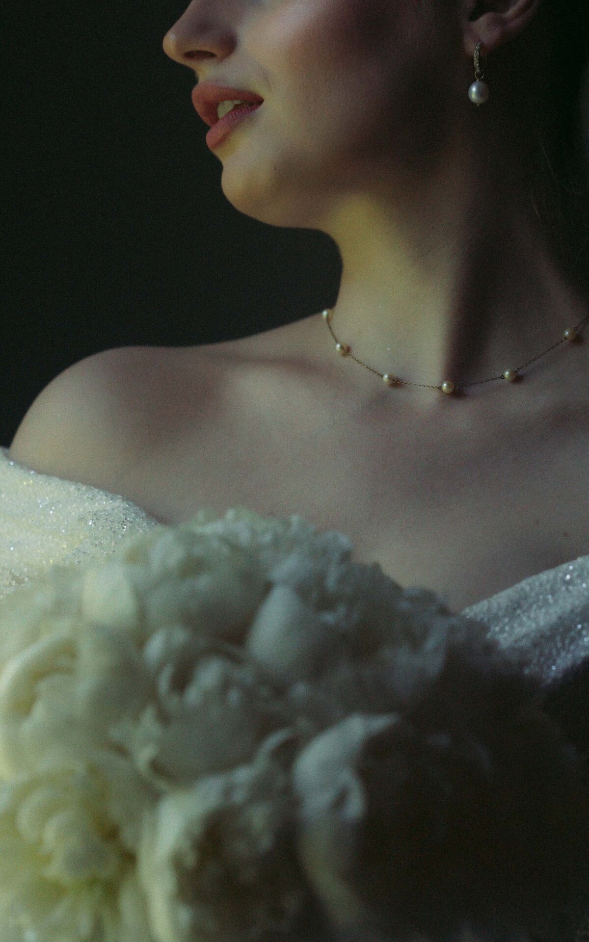Delicate moments of a bride preparing for her wedding day captured in beautiful photography.
