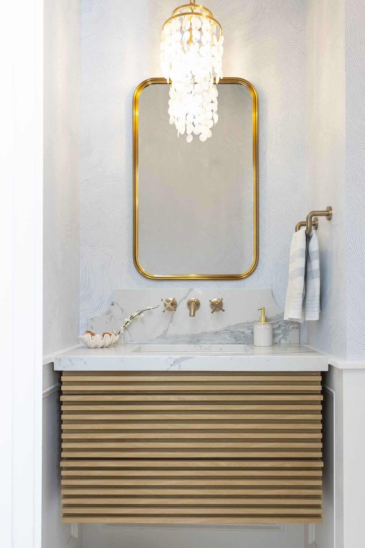 dewine design orlando interior designer contemporary coastal powder bathroom wood slated vanity with accent lighting