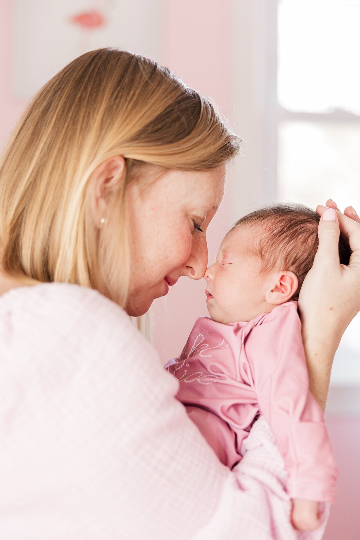 New mama nose to nose with her baby in a NOVA lifestyle newborn session