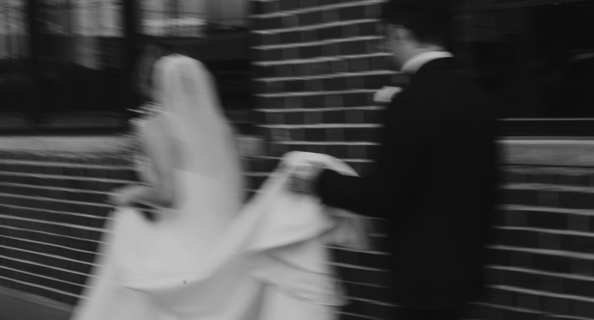 Bride's veil flowing, capturing love and elegance in Indiana wedding.