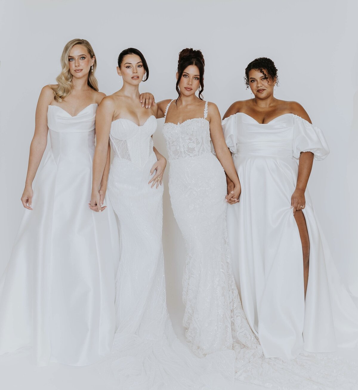 brides clinking glasses of champagne