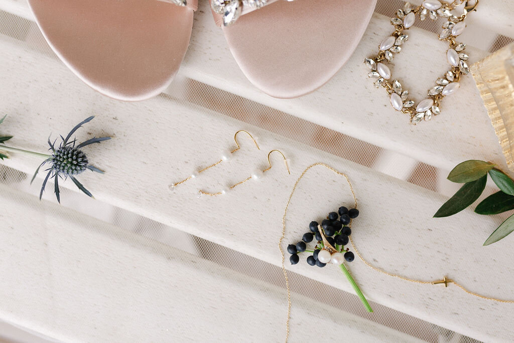 Details shot of the Brides shoes and necklace.