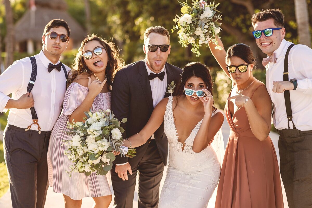 Fun photo of bridal party with sunglasses.