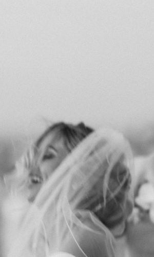 Bride laughing with veil at Casitas at Cheeca, captured by Claudia Amalia, a wedding and lifestyle photographer based in Miami and Florida Keys, South Florida. Destination weddings available.