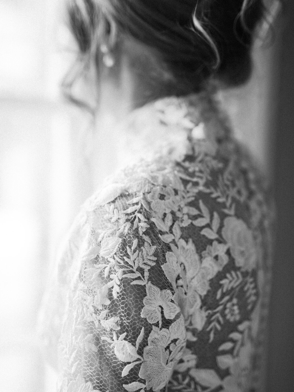 Editorial bride wearing a long sleeve lace dress