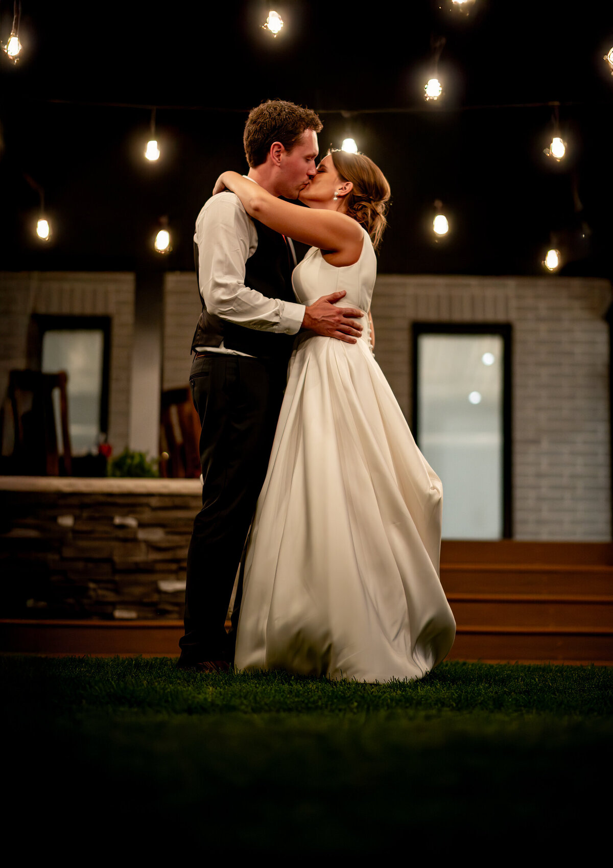 bride and groom first dance kiss
