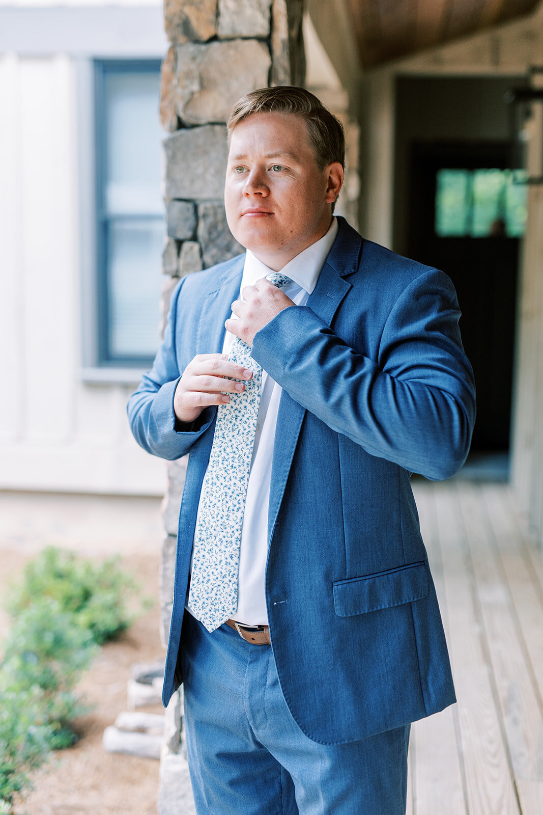 trillium-links-groom-getting-ready-blue-suit-cashiers-north-carolina