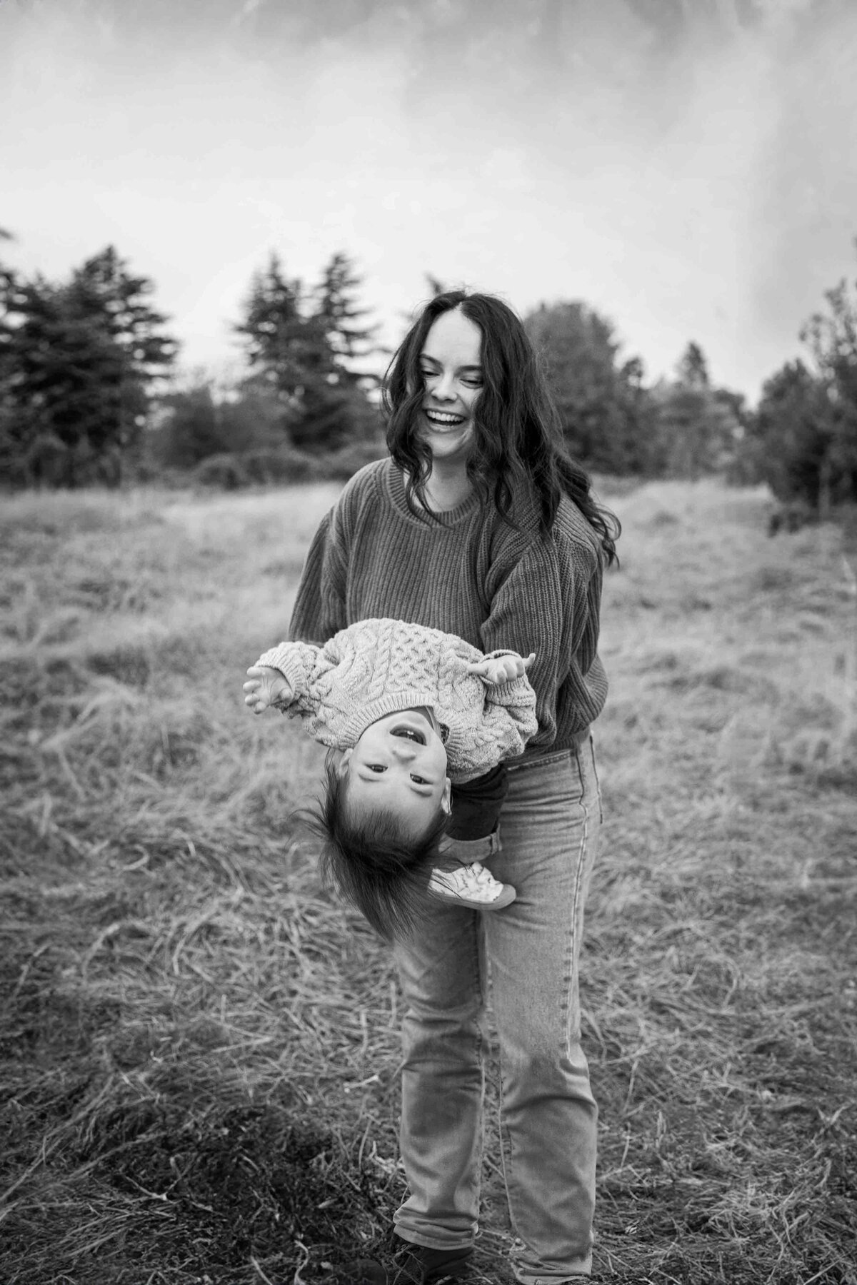 Family Photographer documents mom & toddler playing at Discovery Park Seattle