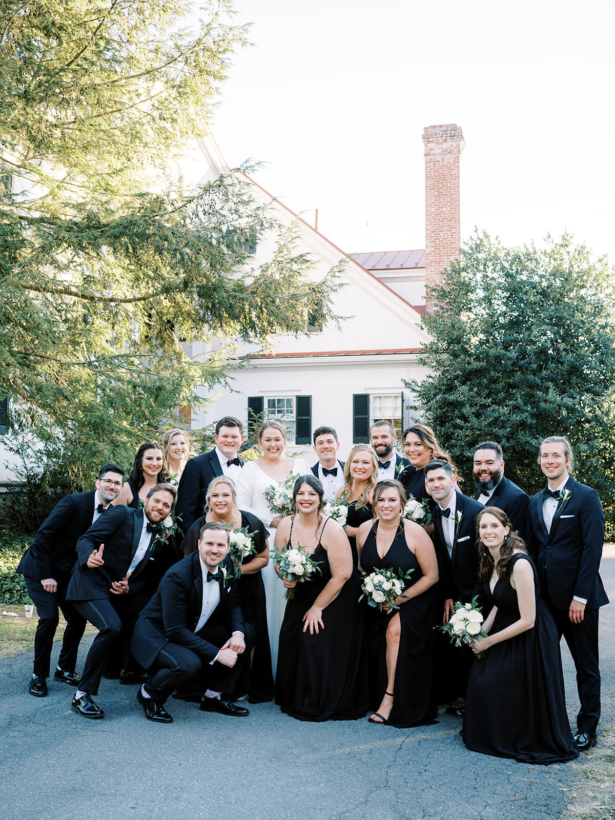 Wedding party wearing black and classic tuxedos