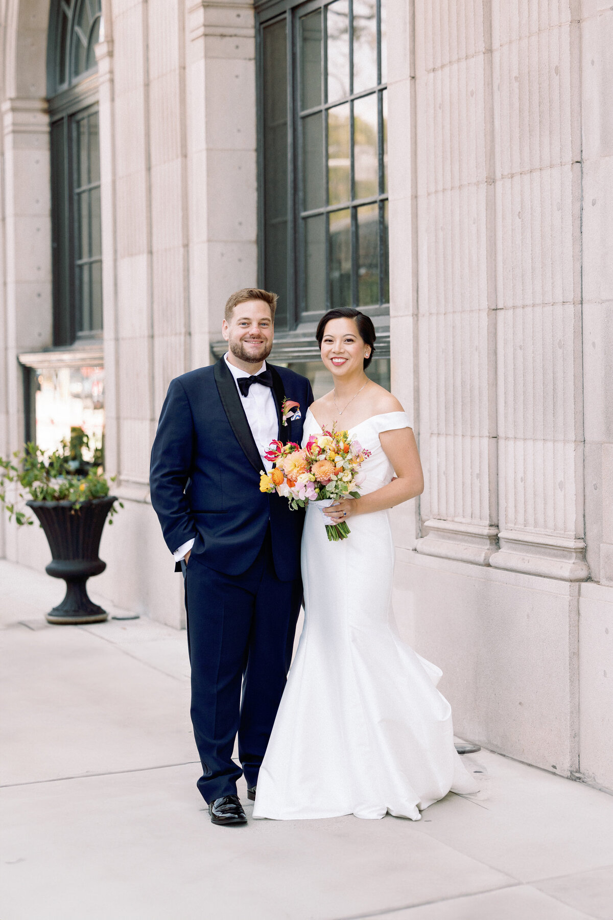 Bride and groom outside the hotel